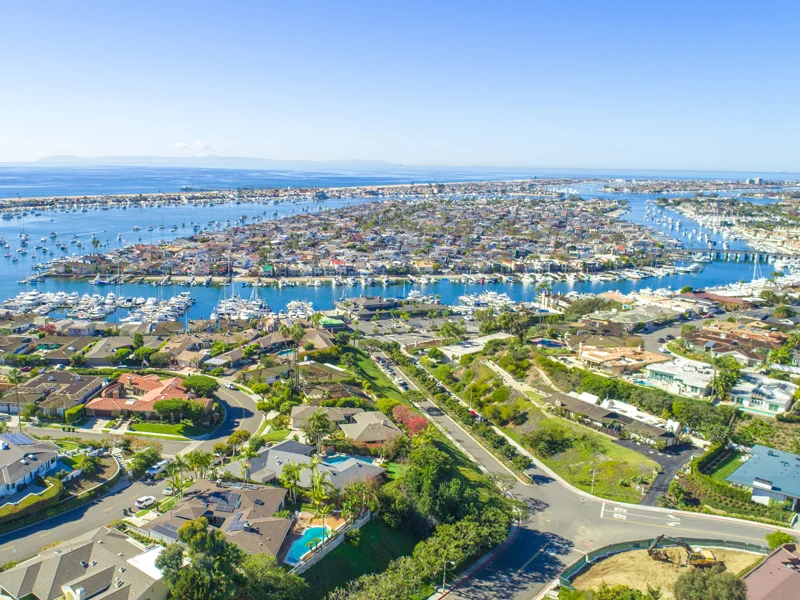Aerial view of Orange County with homes, bay, and yachts - serviced by Cozyappliance
